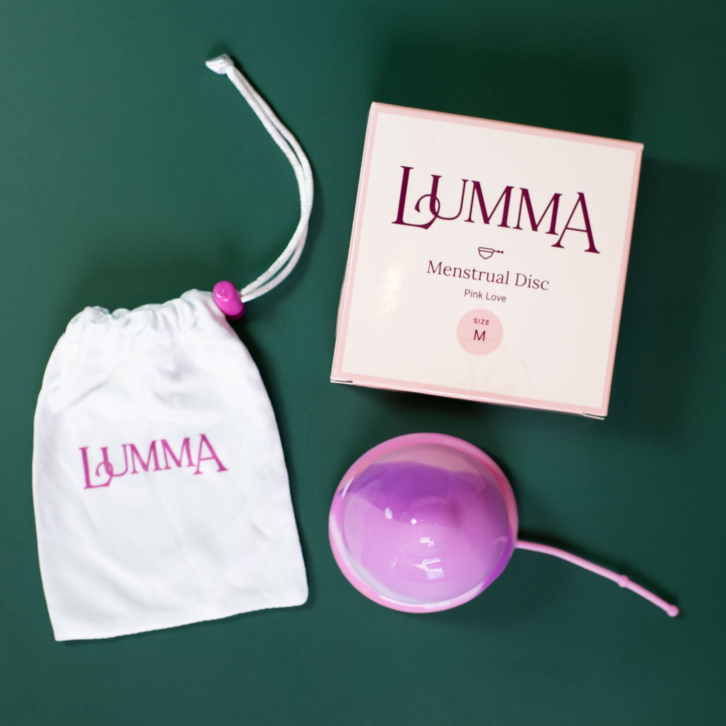 Lumma menstrual disc size Medium in pink with packaging and bag