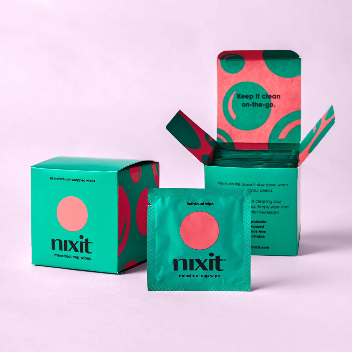 Nixit menstrual cup travel wipes box and individual wipe on purple background