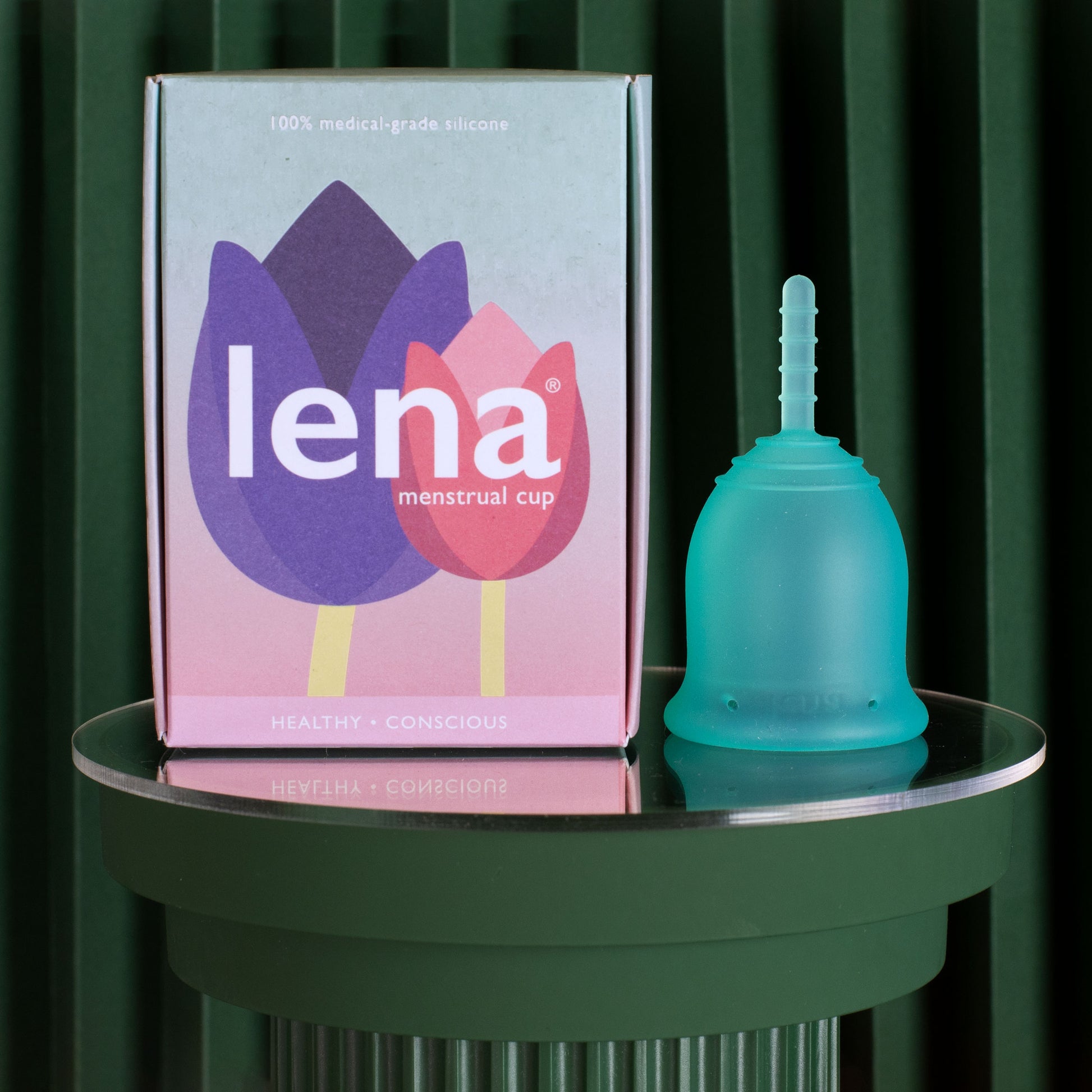 Lena menstrual cup with packaging in turquoise size small