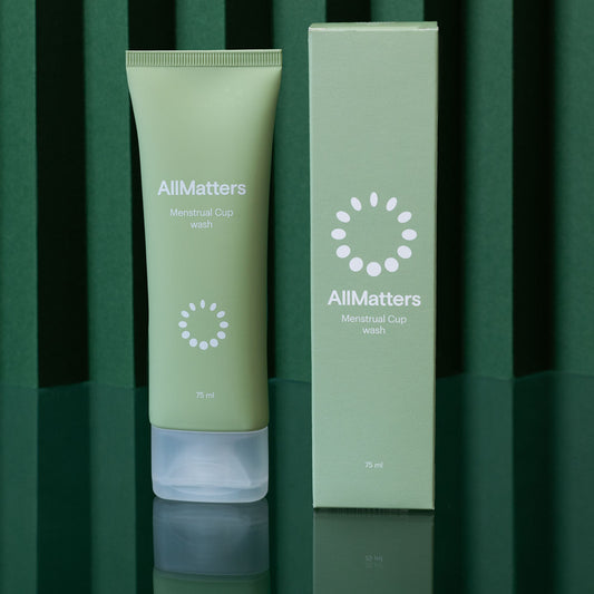 allmatters menstrual cup wash and box on green background