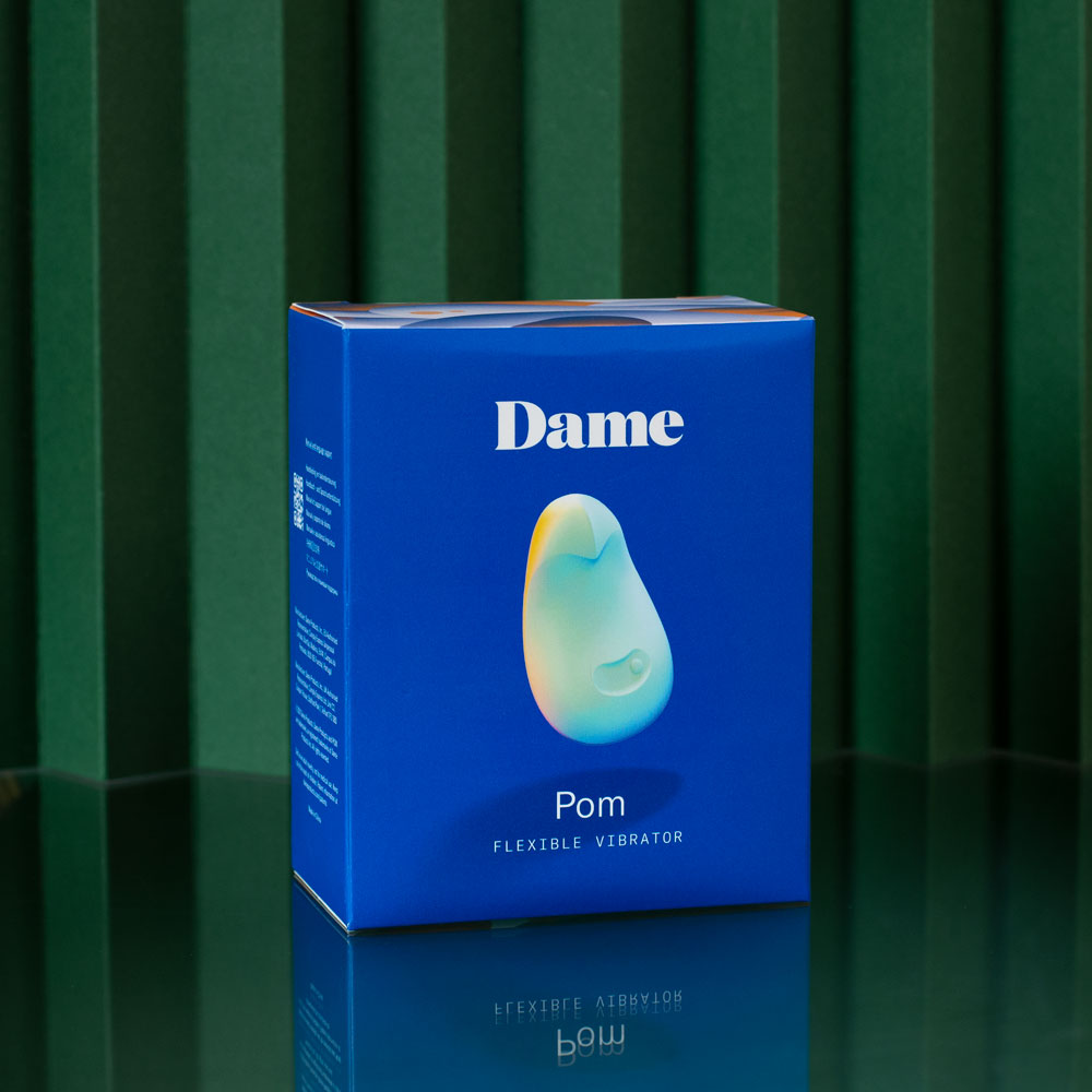 DAME Pom Flexible vibrator in box jade on green background