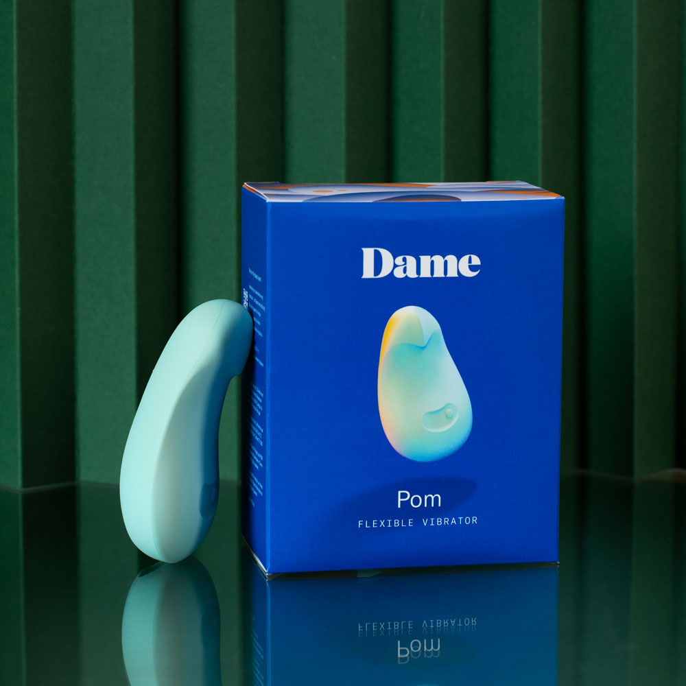 DAME Pom Flexible vibrator leaning on package box